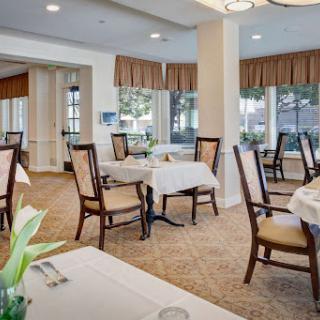 A beautifully designed dining area featuring elegant tables and chairs, creating a welcoming atmosphere for guests.