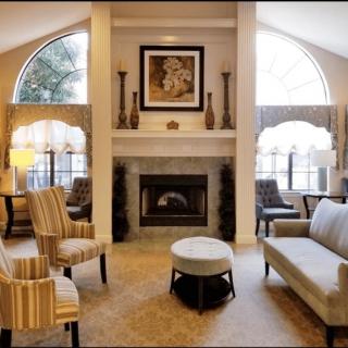 Elegant living room with a cozy fireplace and stylish furniture.