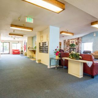 Spacious lobby area with comfortable seating and decorative elements.