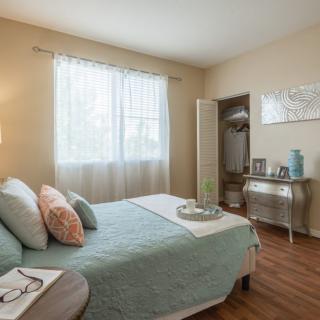 A cozy bedroom with natural light and elegant decor.