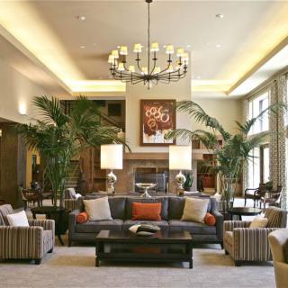 Modern living room with elegant decor and a cozy fireplace.