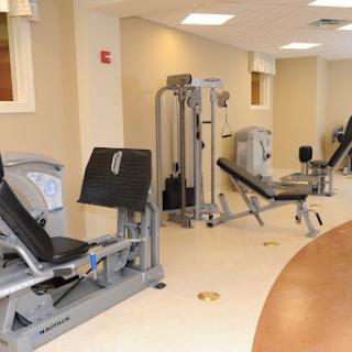 A well-equipped gym featuring various exercise machines for strength training.