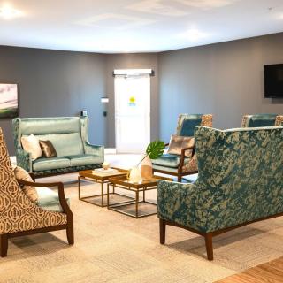 A cozy and modern living room featuring stylish furniture and a comfortable seating area.