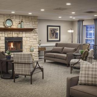 Cozy and elegantly designed living room with a fireplace and comfortable seating.