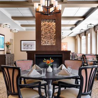 Elegant dining room interior with a neatly set table.