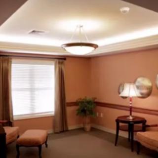 Cozy living room with warm lighting and comfortable seating.