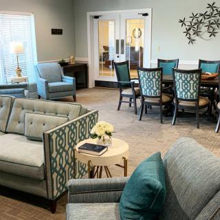 A modern living and dining area with elegant furniture and decor.