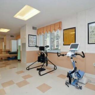 A rehabilitation center featuring exercise equipment including an exercise bike.