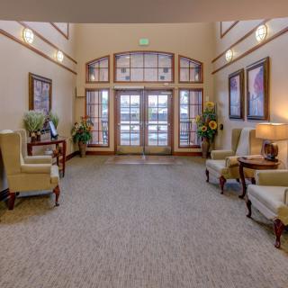A well-decorated lobby with elegant seating and large windows.