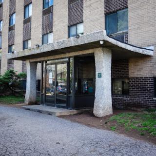 Entrance of a residential building showcasing modern architectural design.