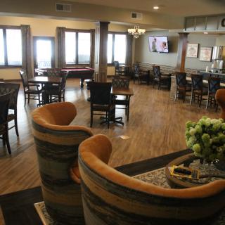 A cozy lounge with comfortable seating and a warm atmosphere.