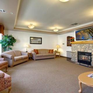 A cozy living room with comfortable seating, a fireplace, and tasteful decor.