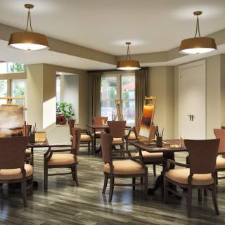 A cozy dining room with wooden furniture and warm lighting.