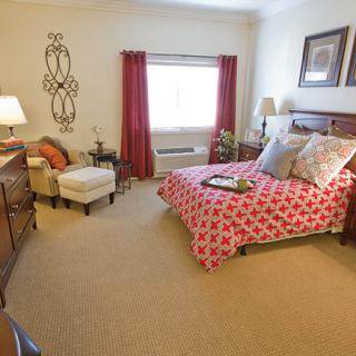A cozy bedroom with a stylish decor and comfortable furniture.