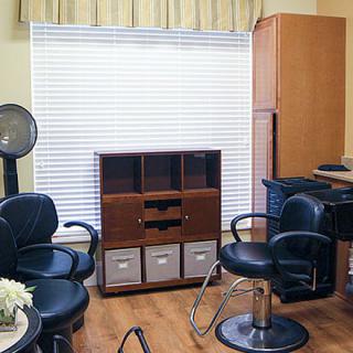 A cozy salon setup with stylish chairs and essential equipment.