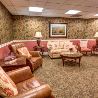 A cozy living room with comfortable seating and warm lighting.