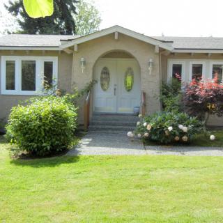 A cozy house with a well-maintained front yard and garden.