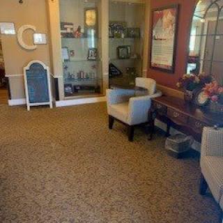 A cozy lobby area with seating and decorative elements.