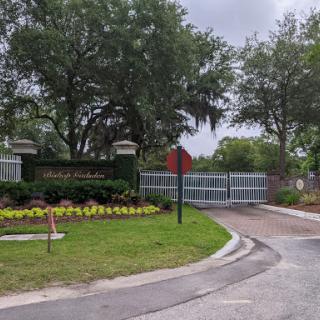 Entrance to a beautifully landscaped gated community.