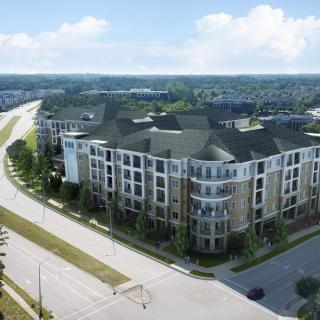 Aerial view of a modern apartment complex in an urban setting.