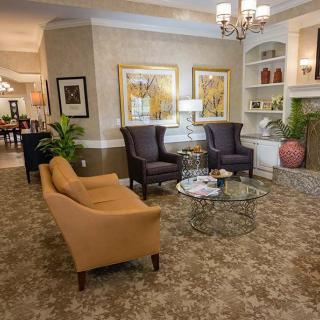 A cozy and elegantly decorated living room with comfortable seating and tasteful decor.