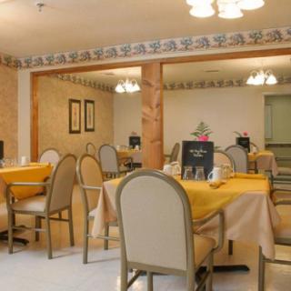 A cozy restaurant dining area with neatly arranged tables and chairs.