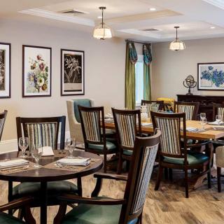 A cozy dining area with elegantly arranged tables and chairs.