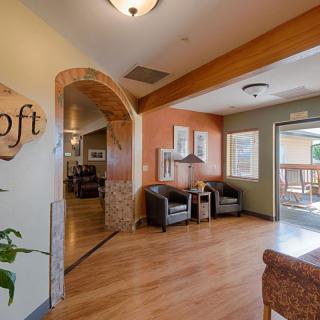 A cozy lobby area with comfortable seating and natural lighting.