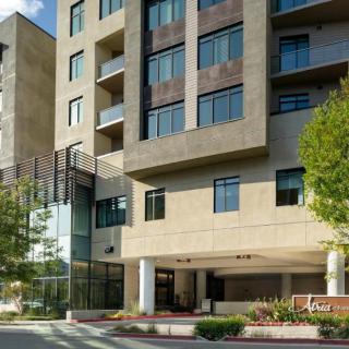 A modern residential apartment building with a welcoming entrance.