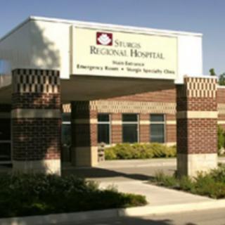 The entrance of a regional hospital building with clear signage.