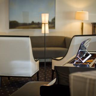 A modern lounge area with comfortable seating and contemporary lighting.