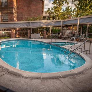 An outdoor swimming pool located in a residential apartment complex.