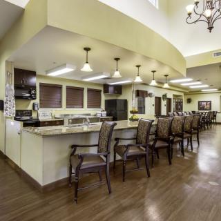 A modern kitchen interior with a spacious countertop and seating area.