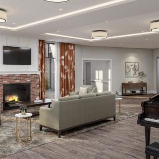 A modern living room featuring a cozy fireplace, comfortable sofa, and elegant piano.