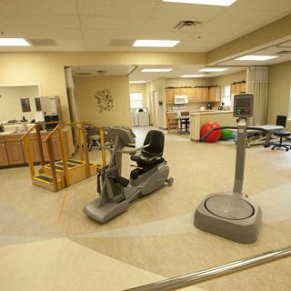 A physical therapy room equipped with exercise machines and facilities for rehabilitation.