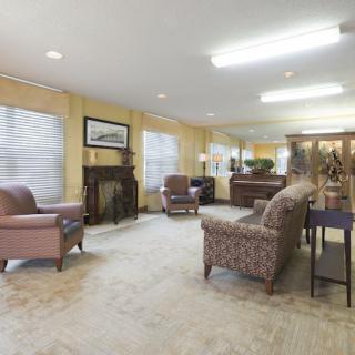 A cozy living room featuring comfortable seating and soft lighting.