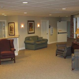 A cozy lobby area with seating and warm lighting.
