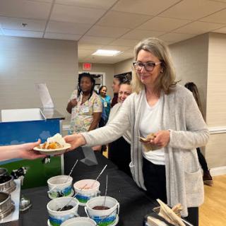 Attendees enjoy refreshments at a community event.