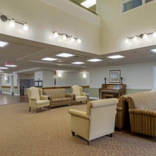 Spacious lobby area with comfortable seating and elegant lighting.