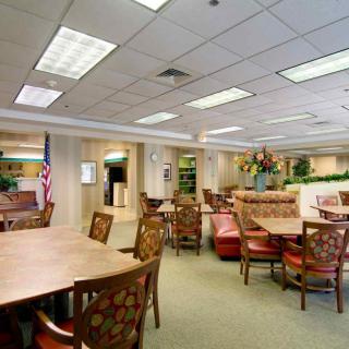 A spacious office waiting area with comfortable seating and elegant decor.