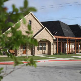 A suburban residential building with brick architecture.