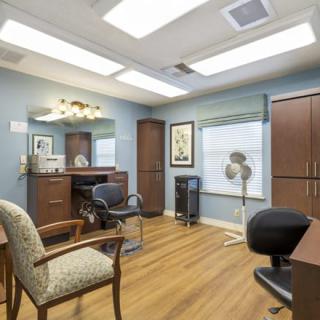 A neatly arranged office space with furniture and decor.