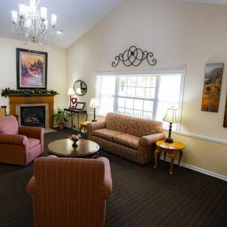 Cozy living room with comfortable seating and elegant decor.