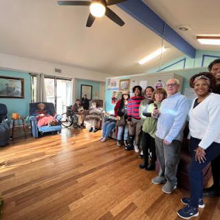 A cheerful group of individuals enjoying their time together in a cozy indoor setting.