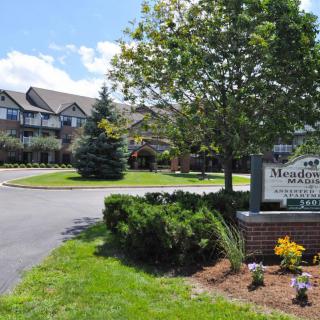A well-maintained senior living community with neatly landscaped grounds and a welcoming entrance.