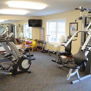 A well-equipped indoor gym featuring various exercise machines.