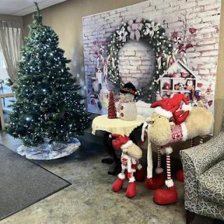 A cozy holiday setting featuring a beautifully decorated Christmas tree and festive decor.