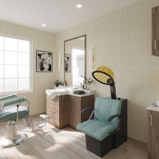 A well-lit hair salon interior featuring a styling chair, sink, and hair dryer.