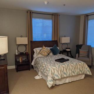 Cozy bedroom with elegant furnishings and soft ambient lighting.