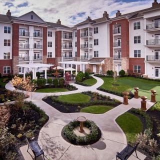 A beautifully landscaped courtyard in a residential apartment complex.
